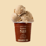 3 scoops of chai kulfi sit atop a brown pint container with a cardamom icon on the front